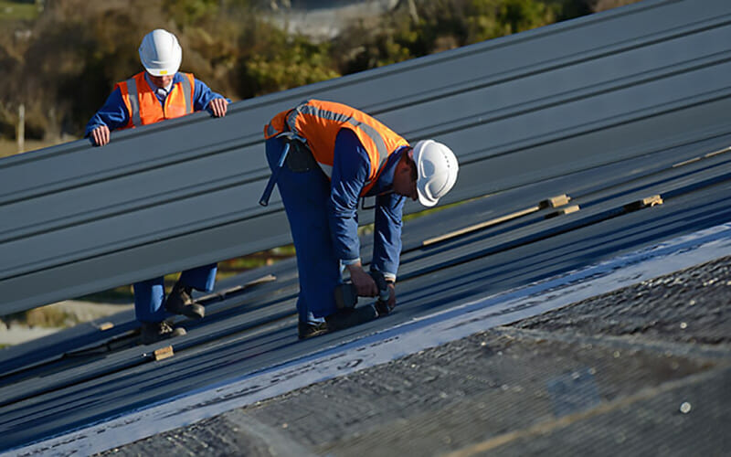 Expert roofing contractor installing a commercial roof in  Robertsville, NJ